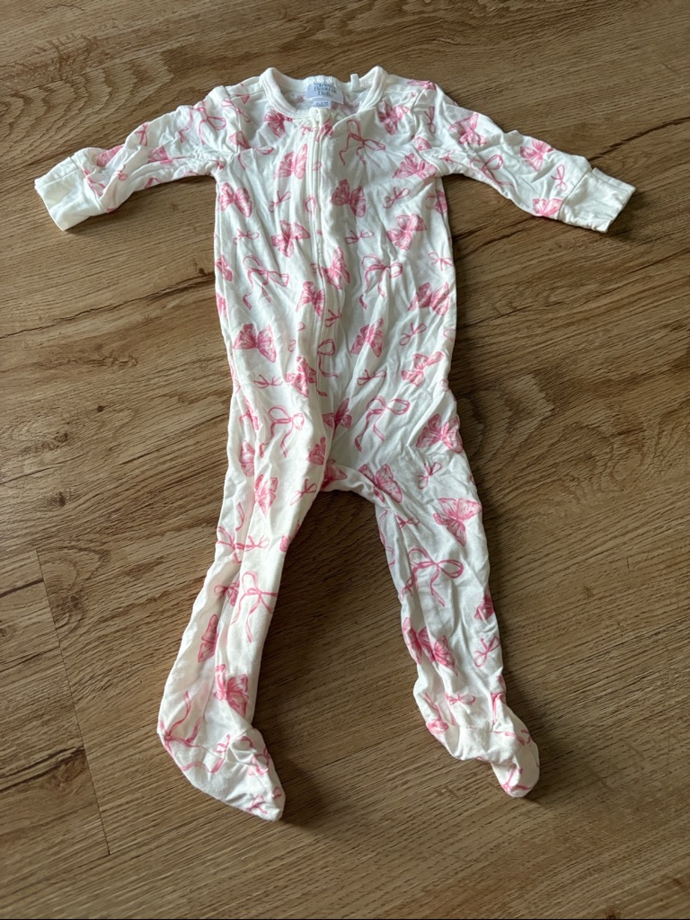 Cream Footed One-Piece with Pink Bow Motif